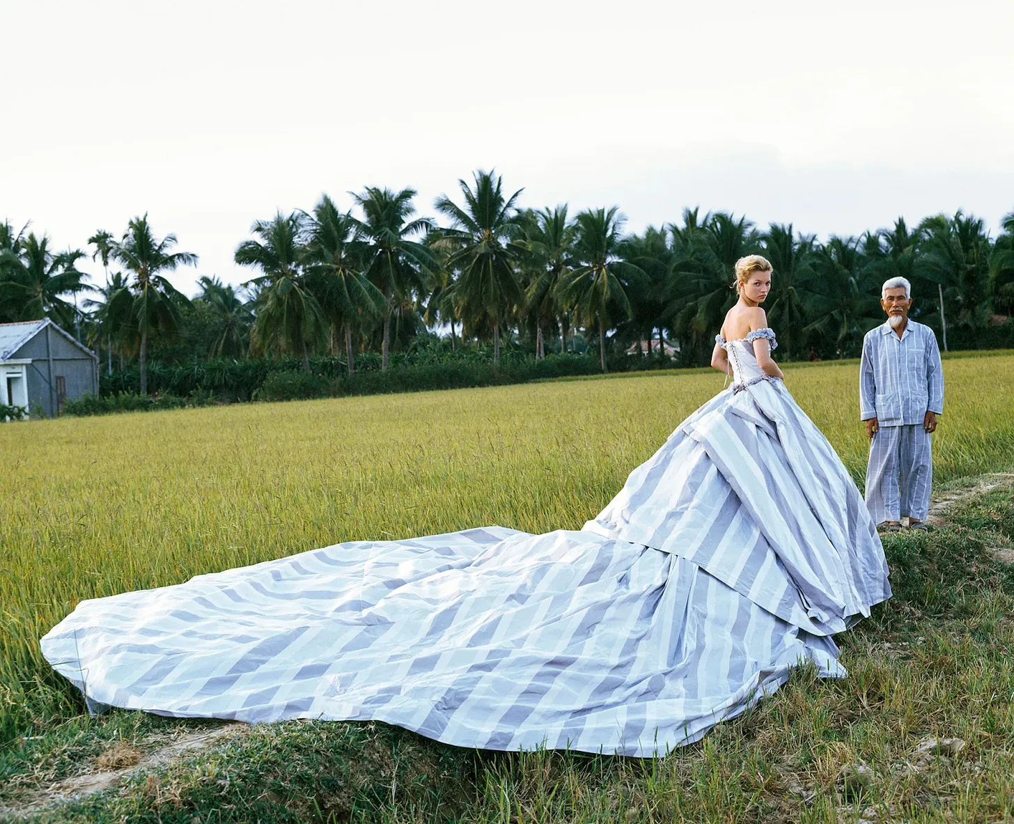 Famous Fashion Photographers You Need To Know by Glam Observer Blogger Giada Graziano: Bruce Weber (1946 - present) photo of a woman and a man in a rice field