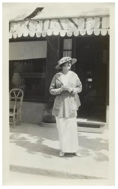 Glam Observer Blogger Giada Graziano shares The History Of The Maison Chanel - in photo: Gabrielle Chanel in front of her boutique in Deauville, 1913